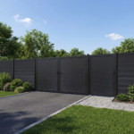 Black Composite fence single gate and a double gate in backyard