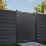 Black Composite  wooden gate with a matching fence in a garden setting.