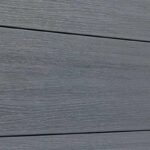 Gray wood-grain vinyl composite fence in excellent condition, durable horizontal planks, perfect for NJ homes.