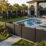 Modern backyard with pool, patio, and garden area with a fence.